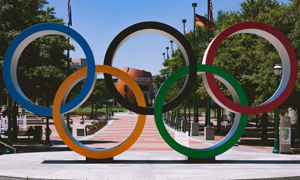 What are the social and cultural implications of hosting the Olympics?